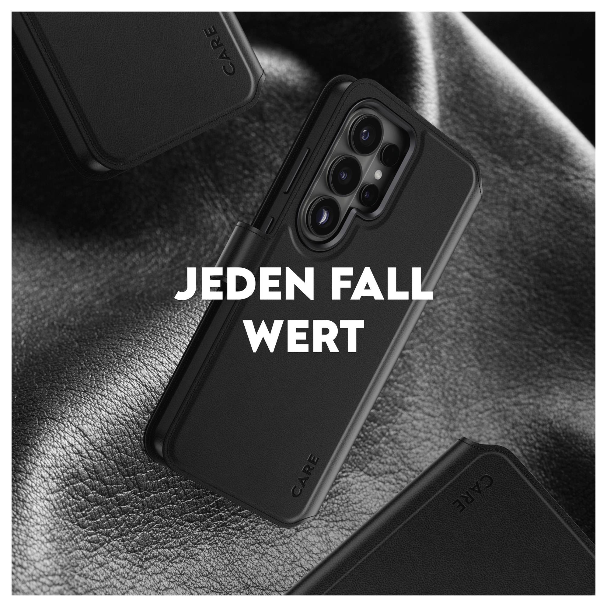 Czarny ochronny case do telefonu pokazany na strukturalnej ciemnej powierzchni z tekstem 'JEDEN FALL WERT' wyśrodkowanym nad nim.
