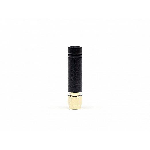 Mała czarna cylindryczna antena ze złotym złączem, pokazana wyizolowana na białym tle.