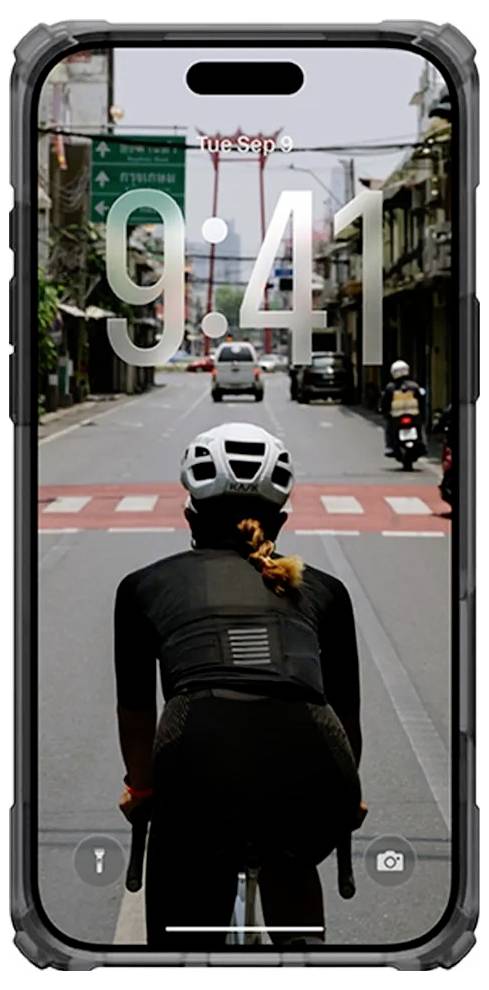 Ekran blokady iPhone'a pokazujący kolarza w kasku jadącego ulicą miasta, z godziną 9:41 i datą Wt Wrz 9 wyświetlaną na zdjęciu.