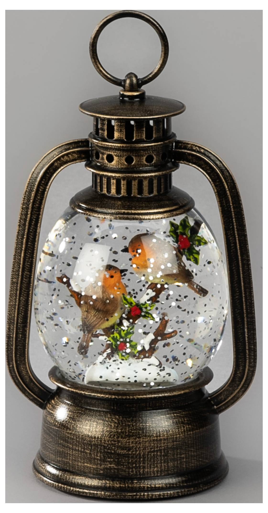 Zabytkowa kula śnieżna w stylu latarni z dwoma ptakami siedniczymi wśród ostrokrzewu i płatków śniegu wewnątrz ramy w kolorze brązu z uchwytem