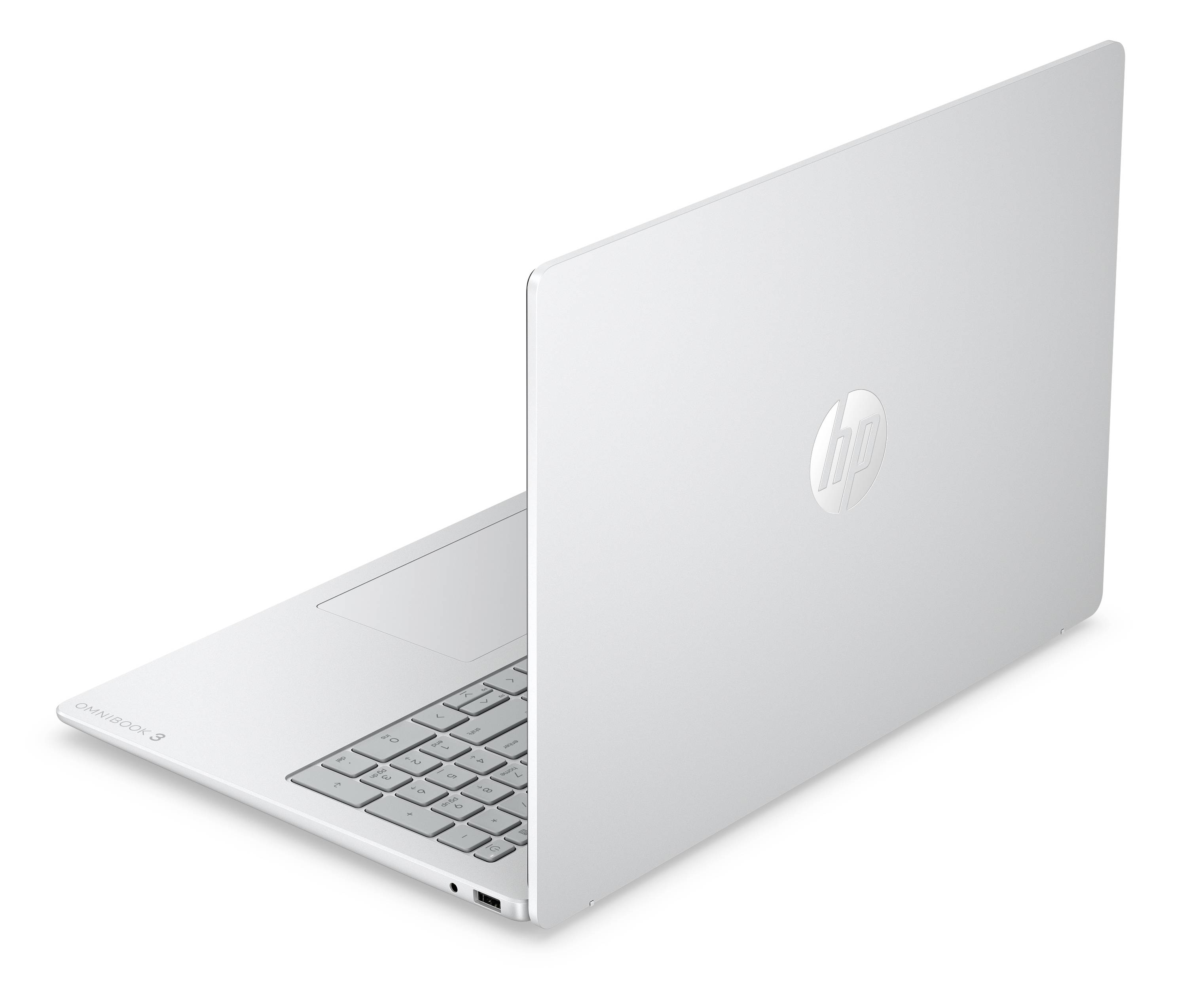 Srebrny laptop HP pokazany częściowo otwarty na białym tle, z widoczną klawiaturą i pokrywą.