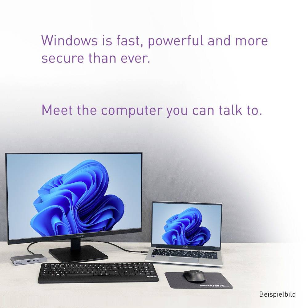 Konfiguracja pulpitu Windows 11 z monitorem, laptopem, klawiaturą, myszą i głośnikiem; tekst mówi: „Windows jest szybki, potężny i bezpieczniejszy niż kiedykolwiek. Poznaj komputer, z którym możesz rozmawiać."