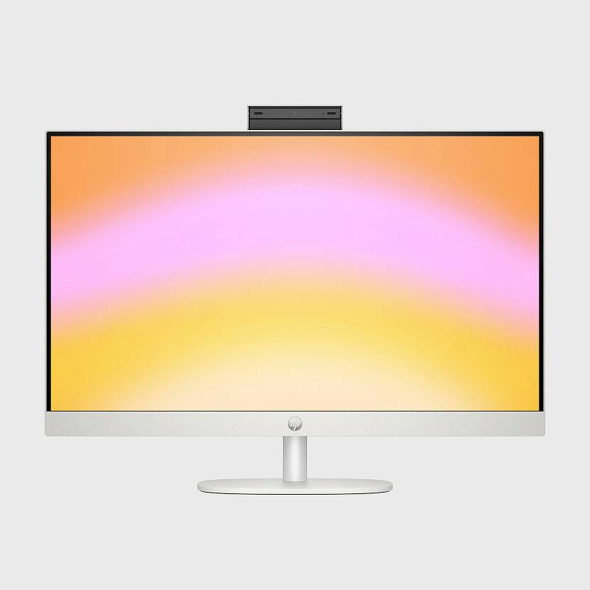 Monitor stacjonarny ze zintegrowaną kamerą internetową, wyświetlający ekran z gradientem różowo-żółtym na białym tle.