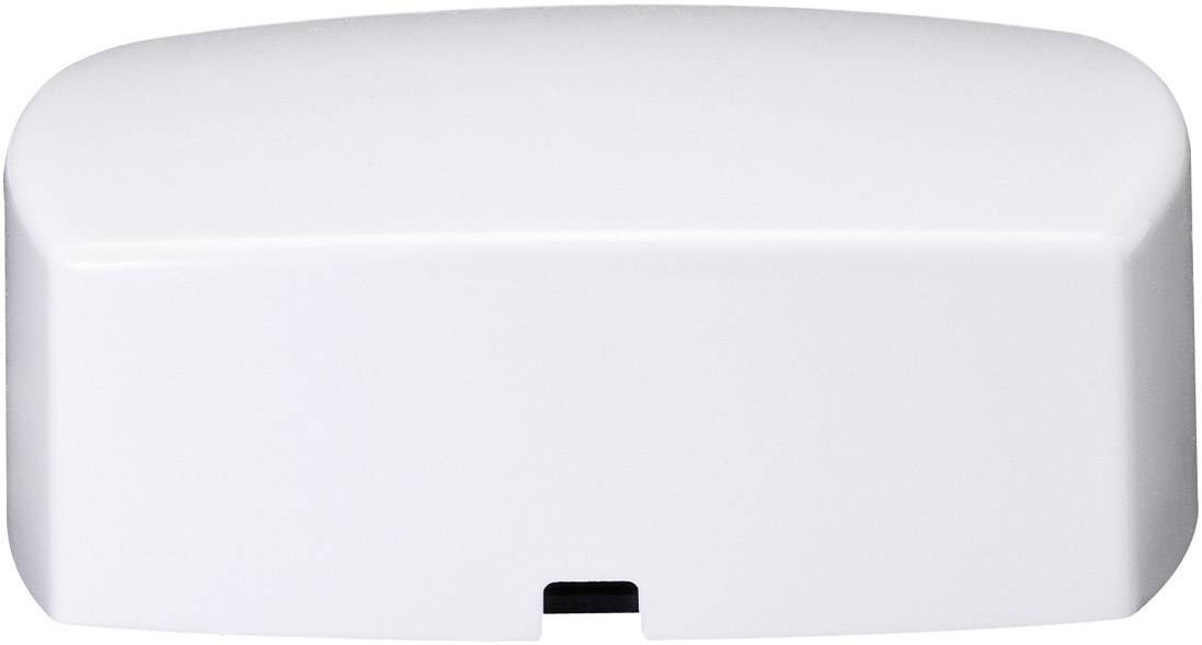 Biały plastikowy dekiel z zaokrąglonymi krawędziami i małym wgłębieniem pośrodku dolnej części.