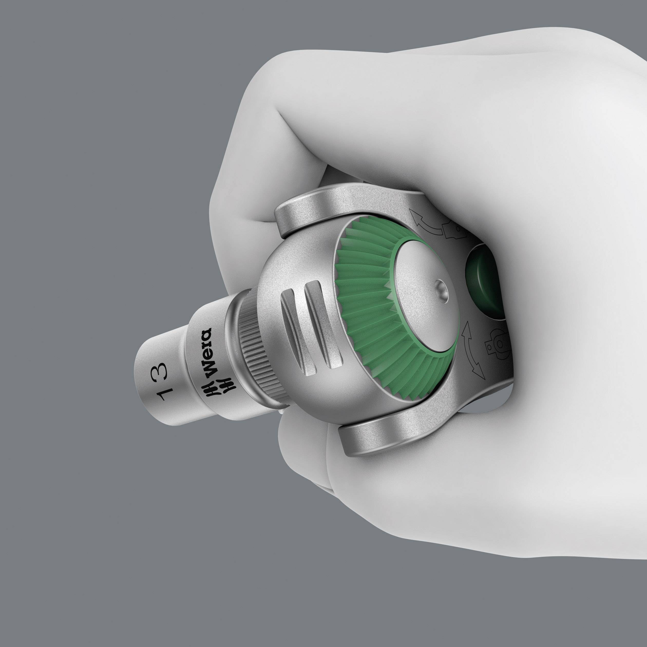 Ręka trzyma regulowany klucz nastawny z zielonym pokrętłem z napisem 'Wera'.