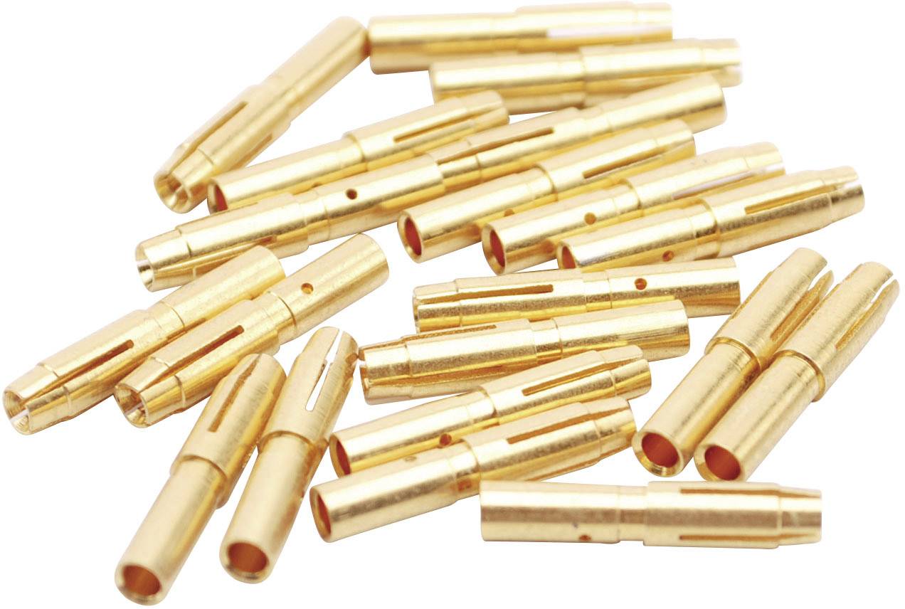 Kilka złotych metalowych złączy leży w nieładzie.