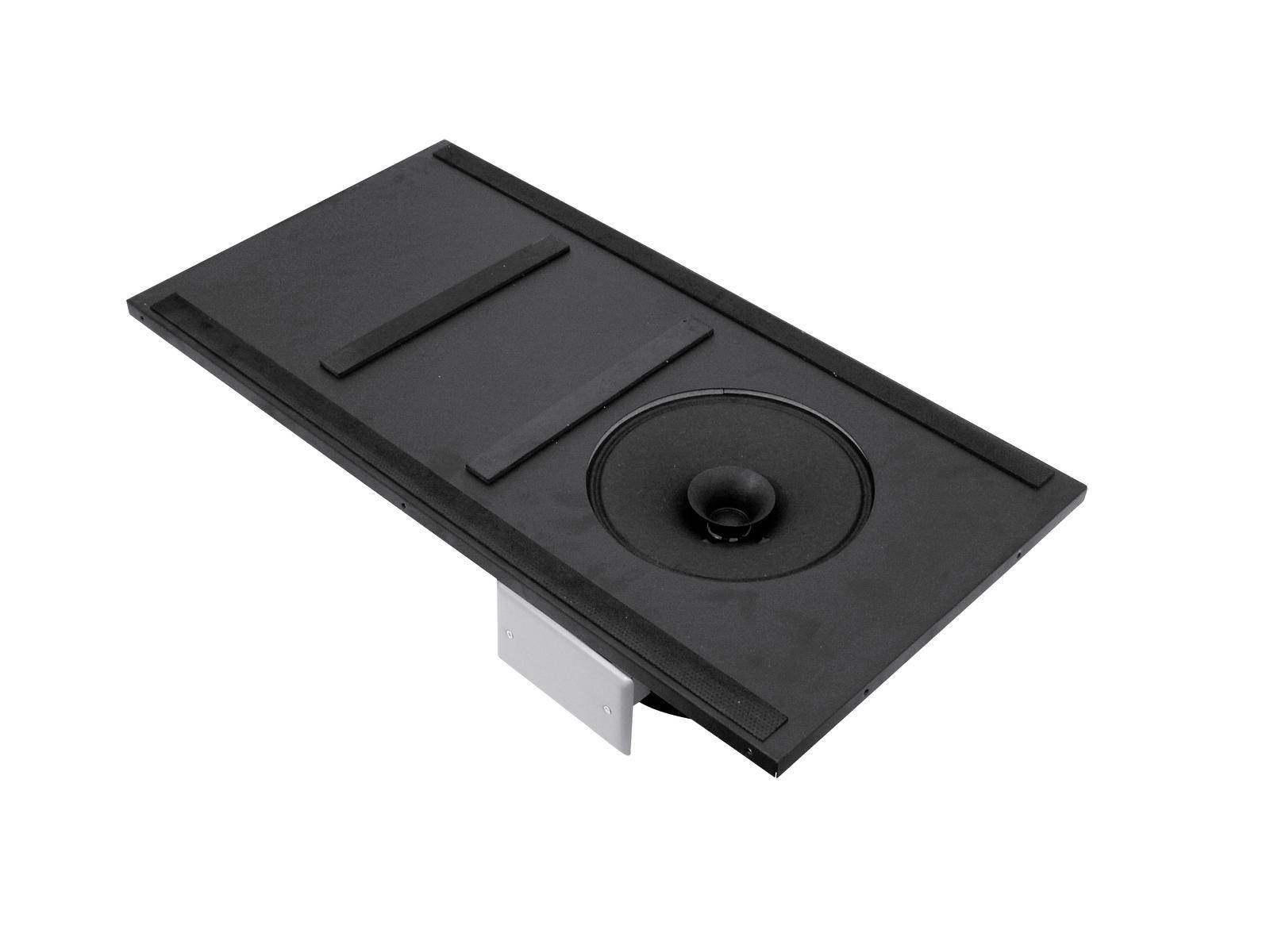 Prostokątna, czarna osłona z wypukłym, okrągłym centrum oraz srebrnym, prostokątnym uchwytem od spodu, prawdopodobnie głośnik.