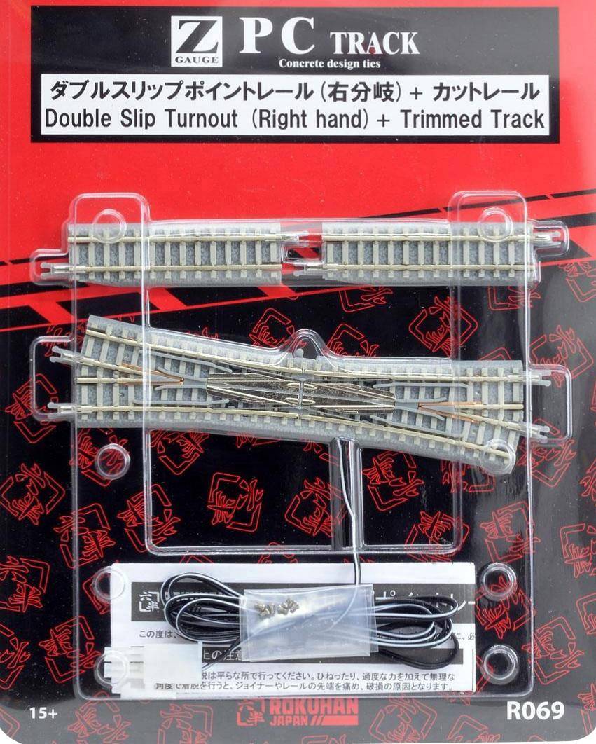 Opakowanie dla torów modelowych w skali Z 'Zwrotnica krzyżowa (prawy zwrot) + Przycinany odcinek toru'. Zawiera odcinki szyn i elementy łączące.