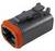 Czarny wtyk z pomarańczowym uszczelnieniem do połączeń elektrycznych, w kształcie prostokąta, z zaciskami i wcięciami na górnej powierzchni.