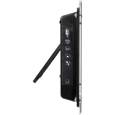 Widok z boku czarnego urządzenia elektronicznego z przyciskami i złączem USB, umieszczonego na składanym stojaku.