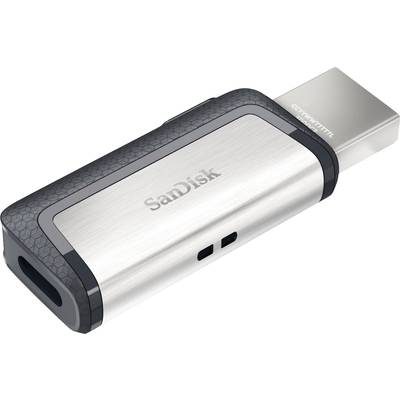 Srebrny pendrive SanDisk z wymienną nasadką ochronną, przeznaczony do przechowywania i przenoszenia danych cyfrowych.