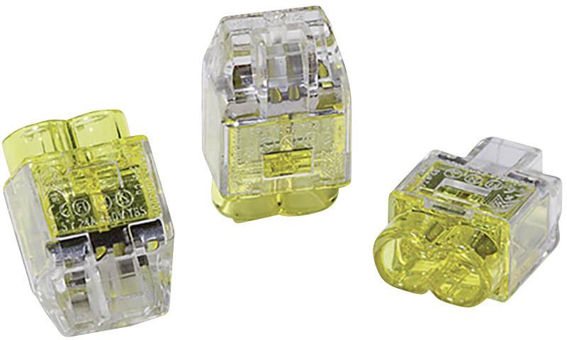 Trzy przezroczyste i żółte złącza elektryczne leżące na białej powierzchni.