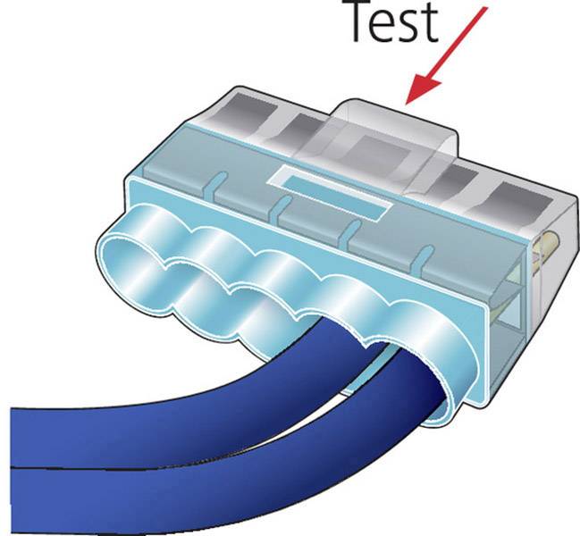 Niebieski wtyk kablowy jest podłączony do dwóch niebieskich kabli. Czerwona strzałka wskazuje na wtyk z napisem 'Test' powyżej.