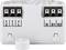 Białe elektryczne urządzenie modułowe z wieloma zaciskami przyłączeniowymi, oznaczonymi numerami i literami dla różnych obwodów elektrycznych.