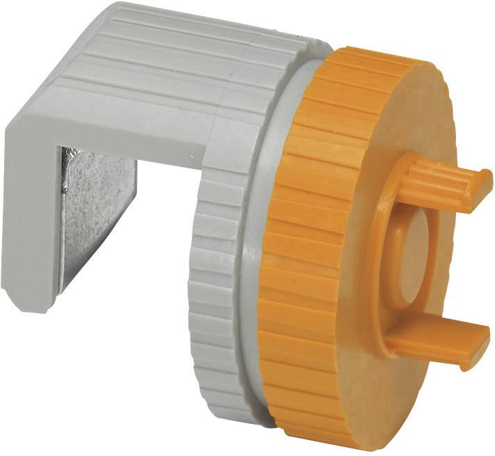 Pomarańczowo-szara plastikowa część wyglądająca jak adapter, z metalowym klipsem z tyłu, prawdopodobnie uchwyt zaworu.