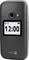 Czarno-szary telefon składany z wyświetlaczem; na ekranie widać '12:00', kamera i lampa błyskowa na górze, logo marki na dole.
