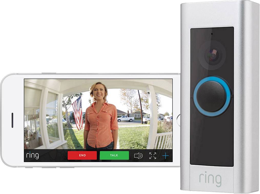 Wideodzwonek obok smartfona. Na ekranie widać osobę stojącą przed drzwiami wejściowymi.