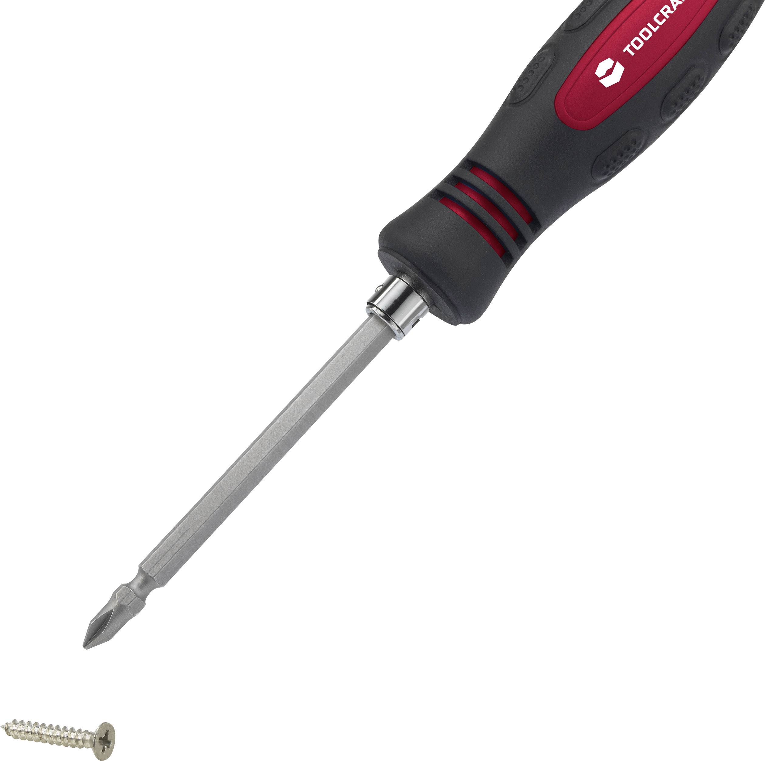 Śrubokręt z ergonomicznym uchwytem leży obok srebrnej śruby.