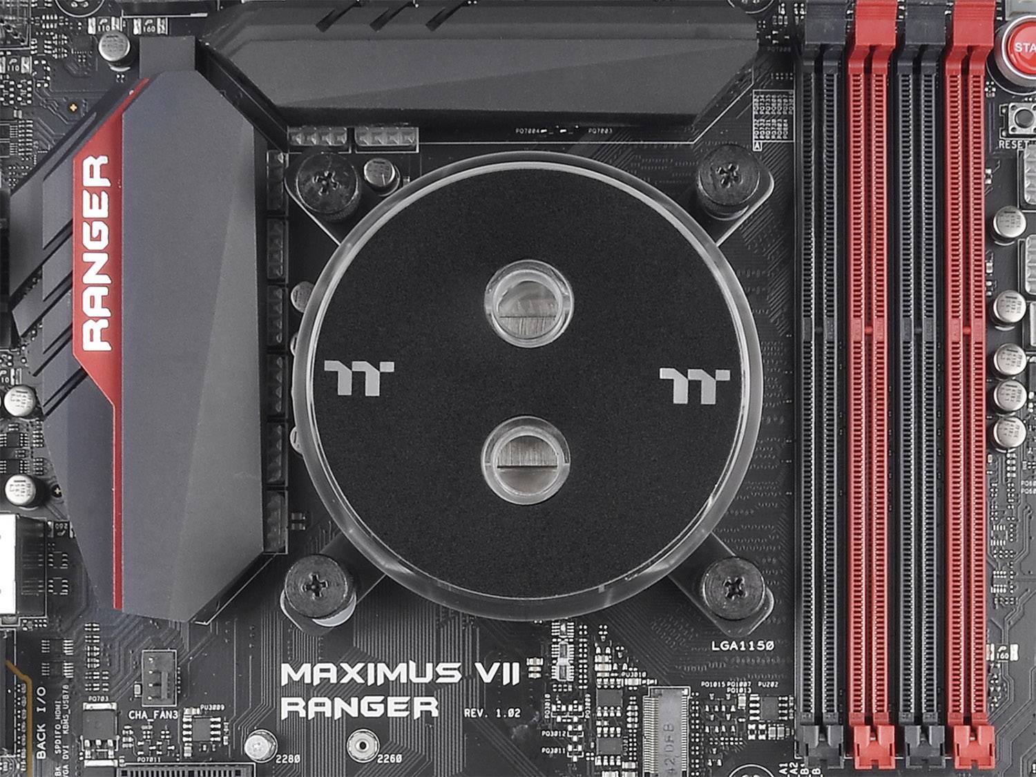 Płyta główna z logo 'Ranger' i dwoma dużymi slotami RAM. Na górze okrągły radiator z logo 'tt'.