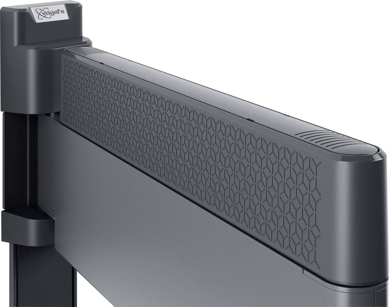 Czarno-szary metalowy nośnik o strukturyzowanym wzorze z przymocowanym ramieniem, prawdopodobnie będący częścią zapory lub statywu.