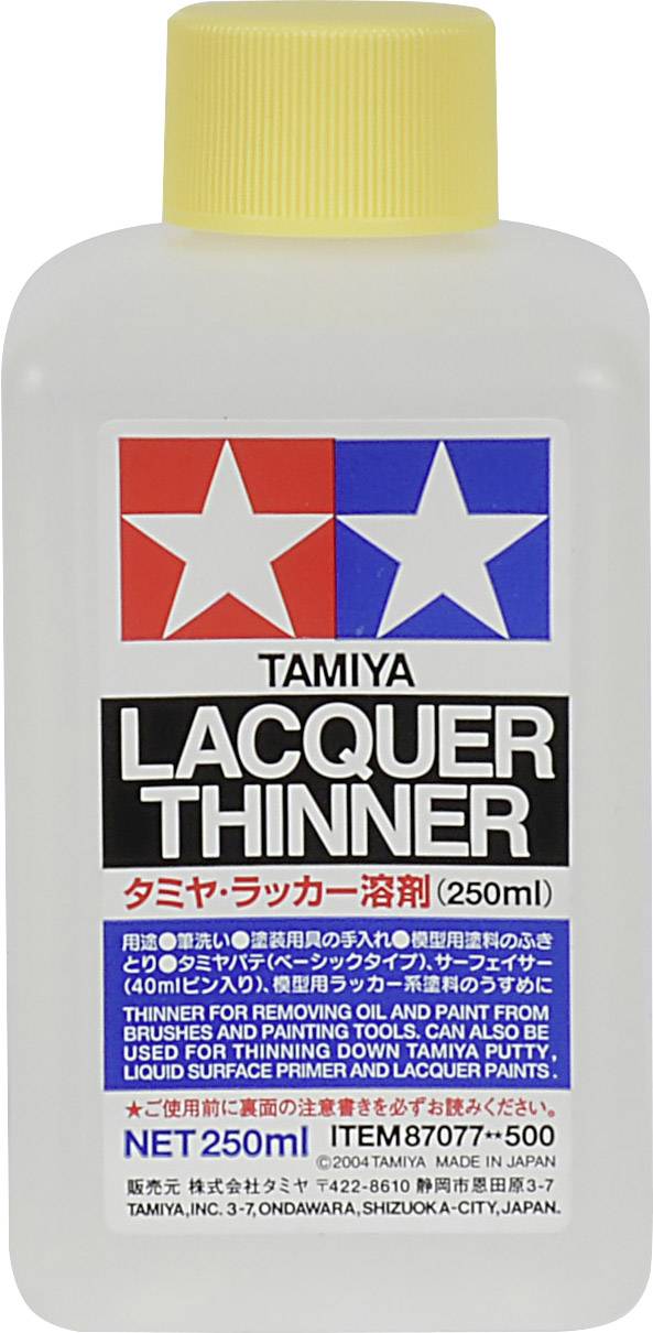 Plastikowa butelka z etykietą 'Rozcieńczalnik lakierniczy Tamiya', 250 ml, do rozcieńczania lakierów. Projekt w kolorach czerwonym, niebieskim i białym.