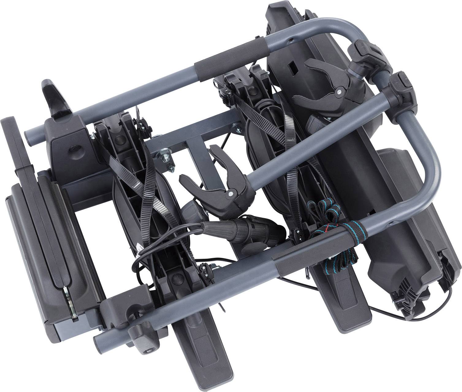 Składany bagażnik rowerowy z mocowaniami i pasami wykonanymi z metalu i tworzywa sztucznego, gotowy do zamontowania na pojeździe.