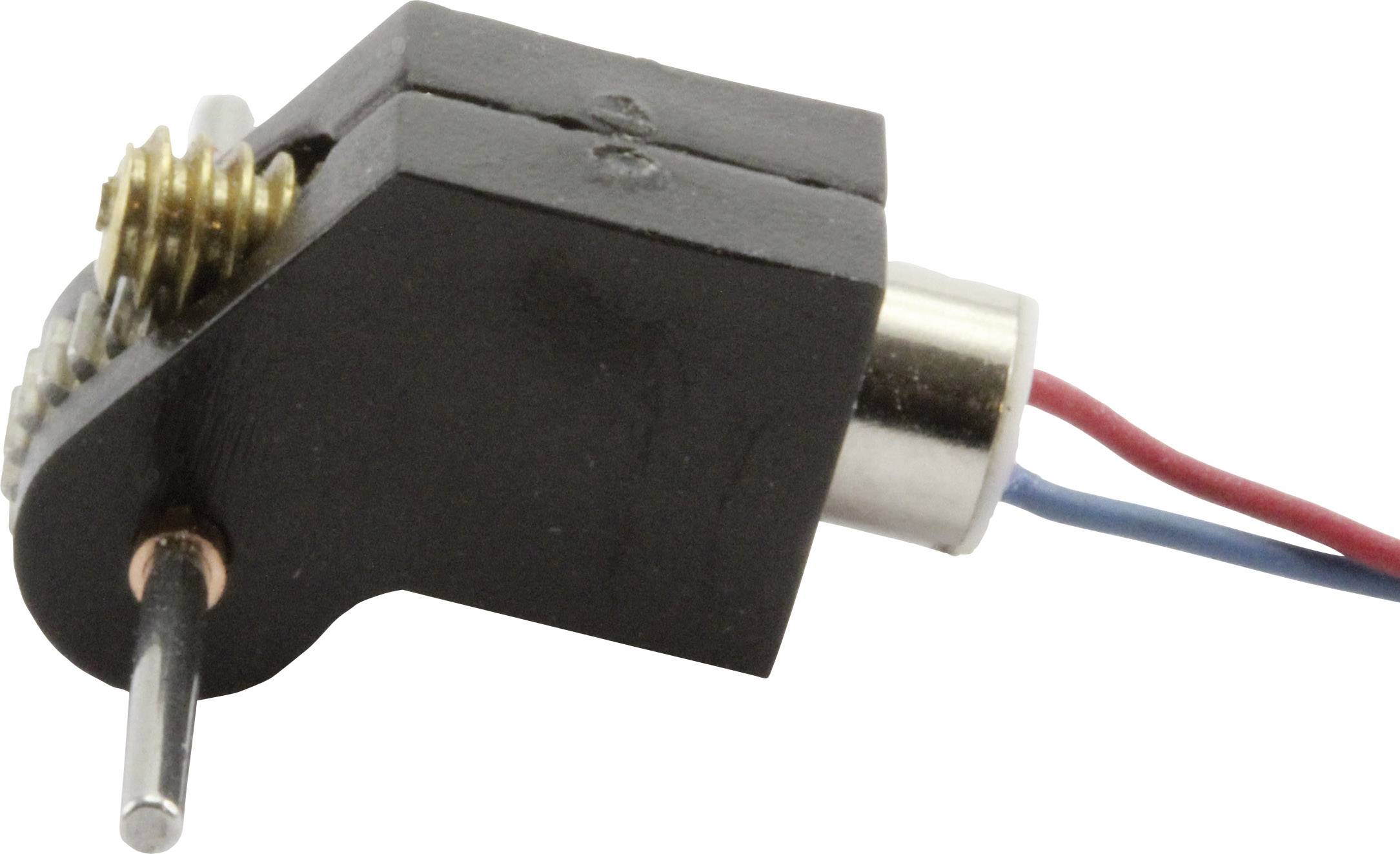 Zbliżenie małego silnika elektrycznego z metalowym kołem zębatym oraz dwoma wystającymi przewodami w kolorze czerwonym i niebieskim.