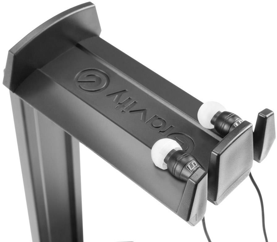 Czarne słuchawki douszne na metalowym stojaku uchwytu słuchawek.