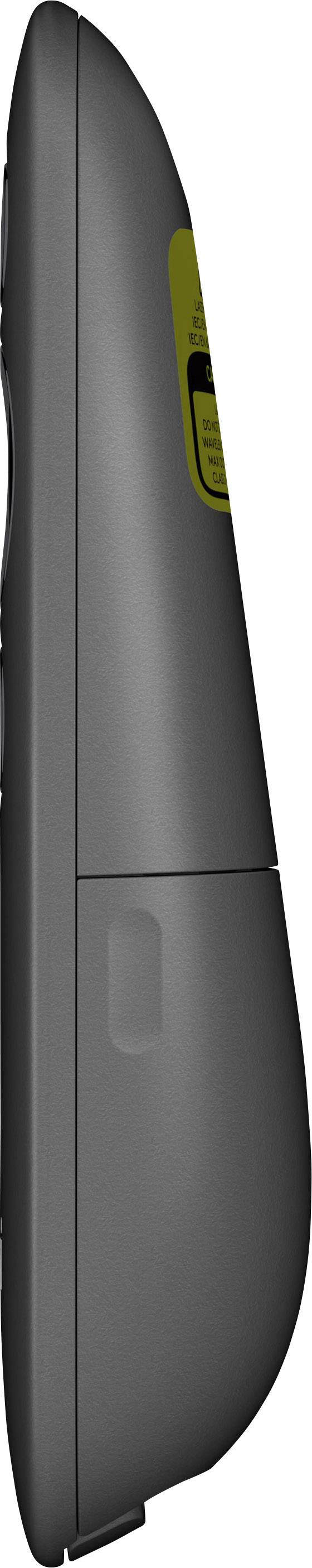 Widok z boku czarnego pilota zdalnego sterowania z żółtą naklejką. Odpowiedni do prezentacji lub sterowania mediami.