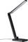 Lampa biurkowa z regulowanym ramieniem, czarną obudową i płaską głowicą na kwadratowej podstawie.