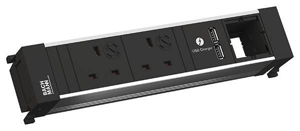 Moduł z dwoma gniazdkami elektrycznymi, dwoma portami USB do ładowania oraz jednym pustym slotem, prezentowany przez Bachmann.