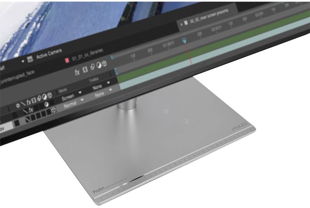 Srebrny monitor z ekranem wyświetlającym interfejs oprogramowania do edycji wideo. Podstawa jest prosta i nowoczesna.