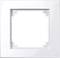 Biała, kwadratowa ramka z pustym wycięciem pośrodku; prawdopodobnie do włącznika światła lub gniazdka elektrycznego.