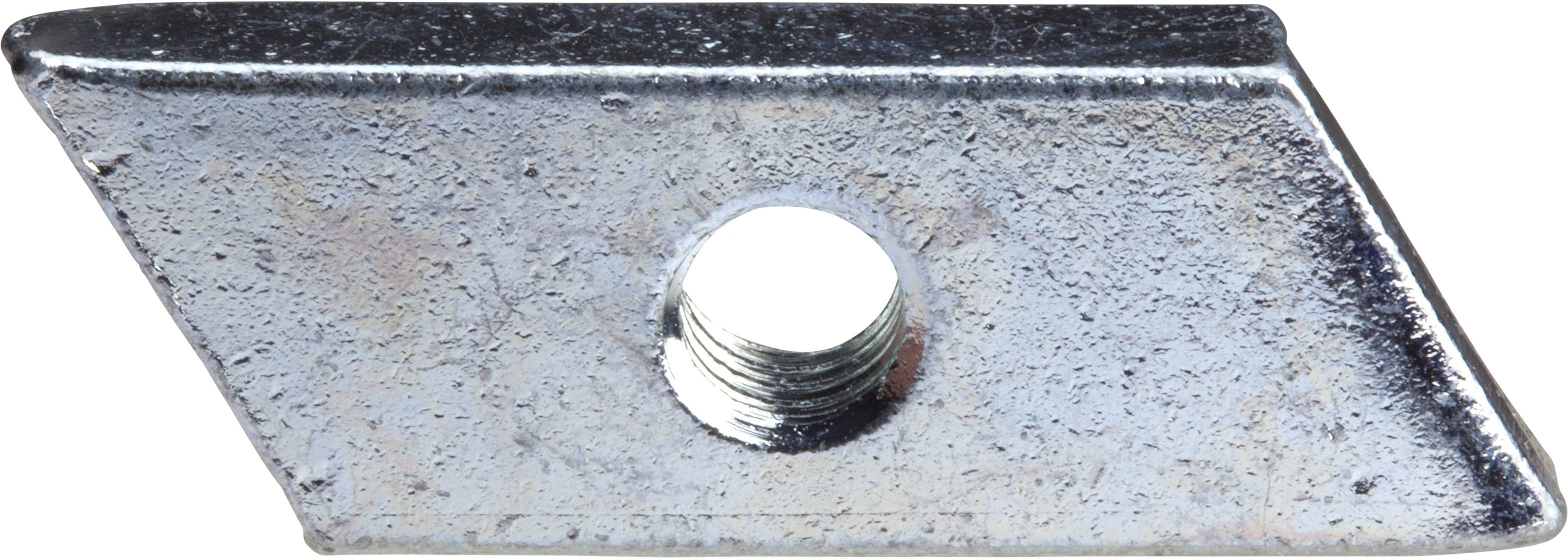 Płyta metalowa o kształcie trapezowym z centralnym, okrągłym otworem.