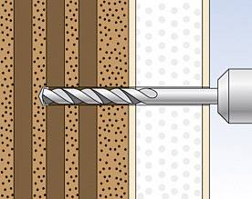 Wiertło penetruje warstwę brązowego materiału i izolacji, najprawdopodobniej ścianę murowaną.