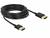 Czarny kabel HDMI, zwinięty, z dwoma złoconymi wtyczkami, odpowiedni do przesyłania sygnału wideo i audio w wysokiej rozdzielczości.