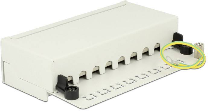 Prostokątny, biały element elektroniczny z otworami po bokach i żółto-zieonym przewodem podłączeniowym po prawej stronie.