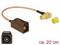 Brązowy adapter antenowy Fakra na złącze SMA, długości około 20 cm, z żółtą zaślepką ochronną. Odpowiedni do połączeń samochodowych.