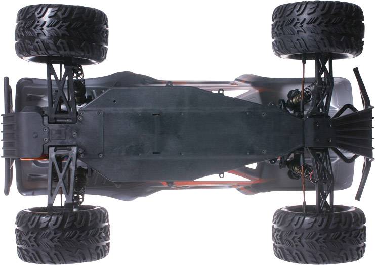 Zdalnie sterowany samochód widziany od spodu, prezentujący solidne, wytrzymałe podwozie z grubymi oponami i szczegółowo wykonanym zawieszeniem kół.
