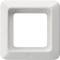 Biała, kwadratowa ramka z tworzywa sztucznego, prawdopodobnie przeznaczona do montażu włącznika światła lub gniazda elektrycznego.