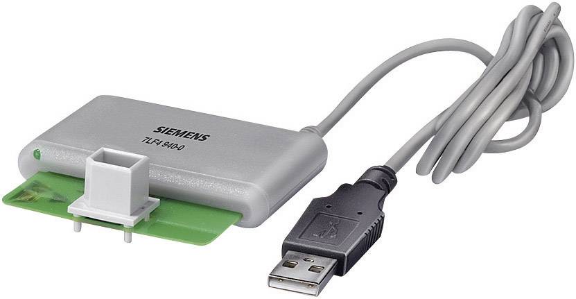 Kabel USB podłączone do urządzenia Siemens TLF-R1A0 służy do transferu danych. Urządzenie jest szare z zielonym obwodem.