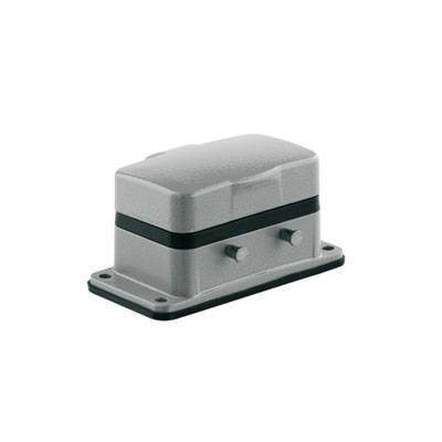 Prostokątne, szare urządzenie przemysłowe z dwoma śrubami po bokach, zamontowane na ciemnej podstawie.