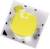 Żółta dioda LED na białej powierzchni, w kształcie kwadratu z małymi czarnymi oznaczeniami w narożnikach.