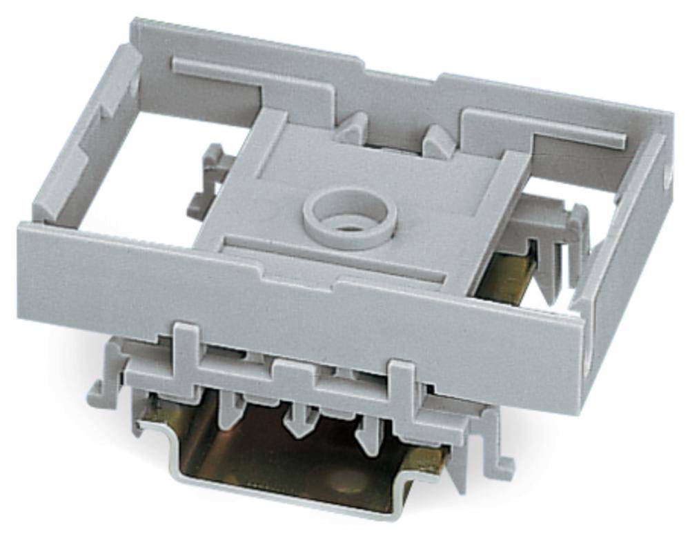 Szary elektryczny adapter z tworzywa sztucznego o prostokątnym kształcie z wieloma złączami po bokach i od spodu.