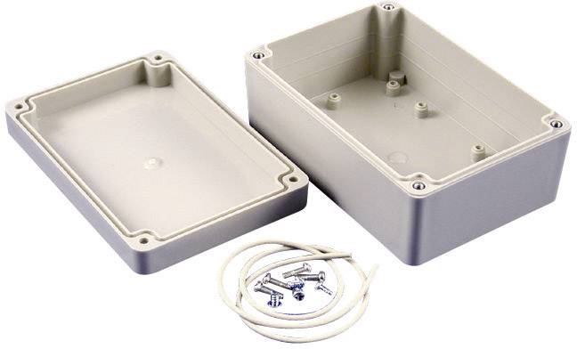 Szare, prostokątne obudowa z tworzywa sztucznego ze zdjętą pokrywą, czterema śrubami i jednym kablem.