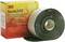 '3M Scotchfil' Elektroizolacyjna masa elastyczna, czarna, na rolce, obok żółtego opakowania z oznaczeniem produktu.