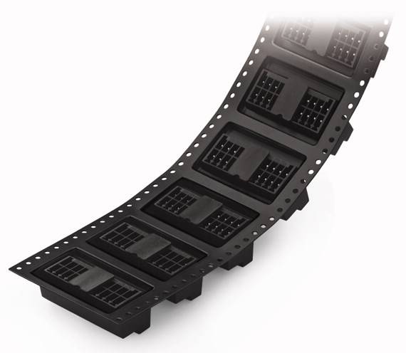 Zakrzywiona rolka z czarnymi złączami rozmieszczonymi w równych odstępach. Odpowiednia do zastosowań elektronicznych i produktów.