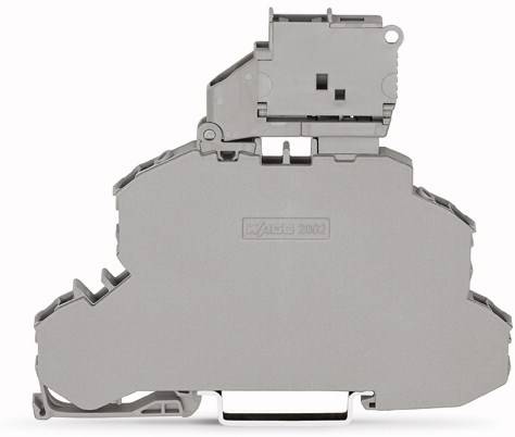 Szara elektryczna listwa zaciskowa używana do łączenia przewodów elektrycznych w tablicach rozdzielczych.