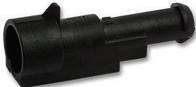 Czarny, cylindryczny element z tworzywa sztucznego z otworem na jednym końcu, prawdopodobnie adapter lub złącze.