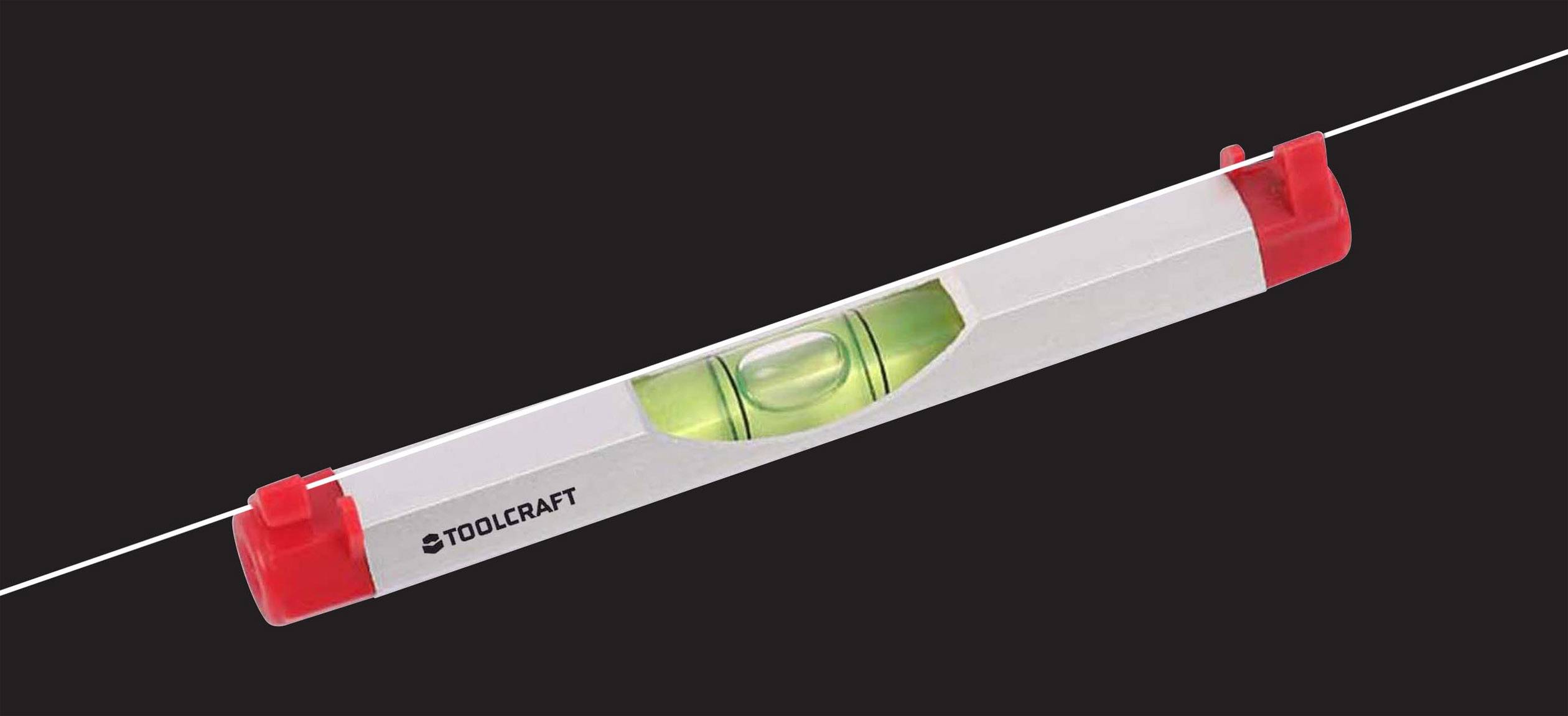 Poziomnica z czerwoną obudową i centralną libelką, wskazuje, czy powierzchnia jest wypoziomowana.